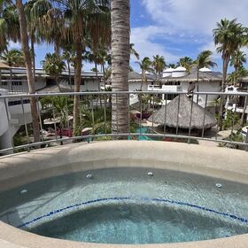 Jacuzzi on outside deck overlooking pool