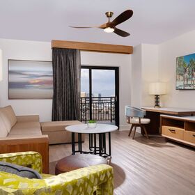 Spacious Phase 2 living room with sleeper sofa and updated contemporary décor.