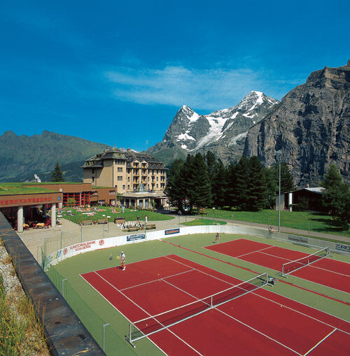 Alpin Palace at a distance; seasonal tennis courts in foreground