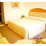 Grand Tower Inn — - Unit Bedroom