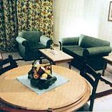Gardenia Sharm Resort — - Unit Dining & Living Area