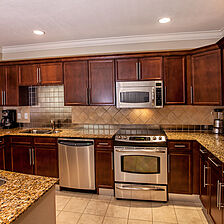 Emerald Grande at HarborWalk Village — Sample unit kitchen