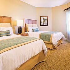 Club Wyndham SeaWatch Resort &mdash; Sample second bedroom with two full beds in larger deluxe suites.