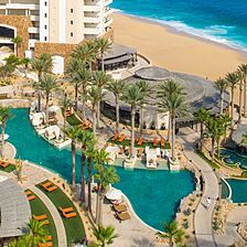 Grand Solmar Land's End Resort — Pool Area With Loungers, In-Pool Cabanas, and Umbrellas