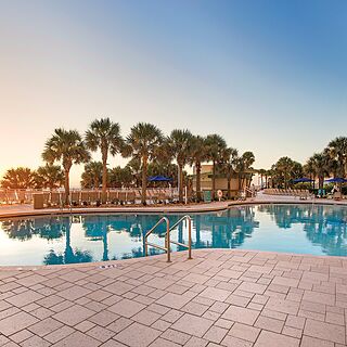 Club Wyndham Ocean Walk — Beach-View Pool With Loungers and Umbrellas