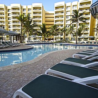 The Royal Sands — Pool Area With Loungers, Umbrellas, and Cabanas
