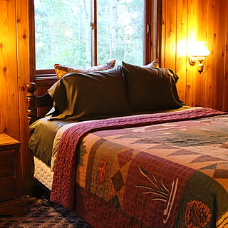 Glacier Wilderness Resort — Queen size bed with separate outside entrance