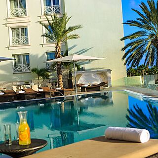 Renaissance Wind Creek Aruba - Ocean Suites — Pool With Loungers and Umbrellas