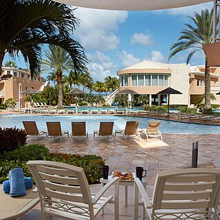 Divi Aruba Phoenix Beach Resort — Pool With Loungers and Umbrellas