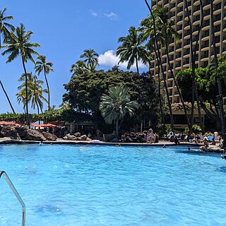 Lagoon Tower by Hilton Grand Vacations — Accessible Pool Area With Loungers Near Pool Bar