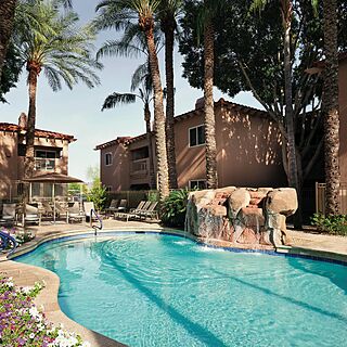 Sheraton Desert Oasis — Small Pool With Loungers and Umbrellas