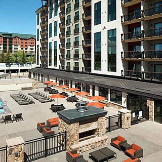 Sheraton Steamboat Resort Villas — Pool Area With Loungers, Umbrellas and Firepits