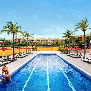 Royal Haciendas — Lap Pool With Loungers and Umbrellas