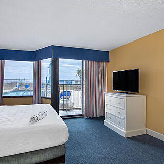 Ocean Club Resort Myrtle Beach, a Ramada by Wyndham — Sample bedroom