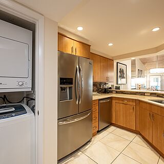 Kitchen with full size washer and dryer